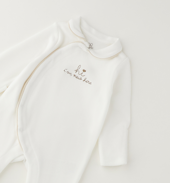 detail Unisex kojenecký overal s chodidly IDO